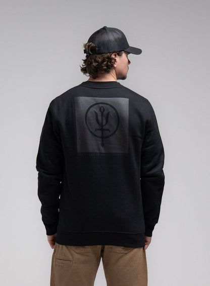 Jack Is 6ft 3" And Wears Size: L | Hem Studio Image Of Model Wearing Insignia Jumper - Black Mark In Obsidian Black (SS Model)