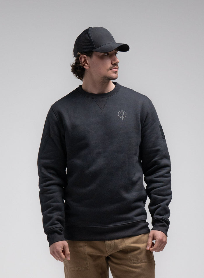 Jack Is 6ft 3" And Wears Size: L | Hem Studio Image Of Model Wearing Insignia Jumper - Black Mark In Obsidian Black (SS Model)
