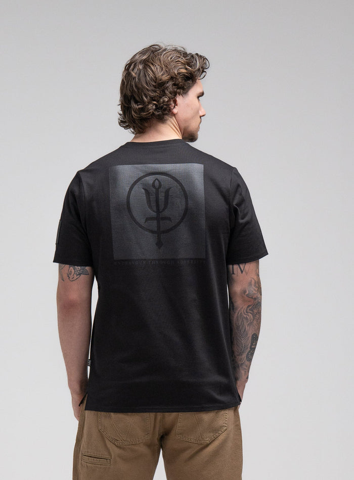 Jack Is 6ft 3" And Wears Size: L | Hem Studio Image Of Model Wearing Insignia T-Shirt - Black Mark In Obsidian Black (SS Model)