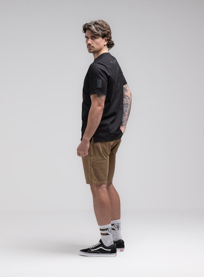 Jack Is 6ft 3" And Wears Size: L | Hem Studio Image Of Model Wearing Insignia T-Shirt - Black Mark In Obsidian Black (SS Model)