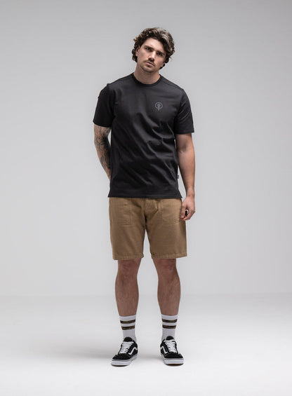 Jack Is 6ft 3" And Wears Size: L | Hem Studio Image Of Model Wearing Insignia T-Shirt - Black Mark In Obsidian Black (SS Model)