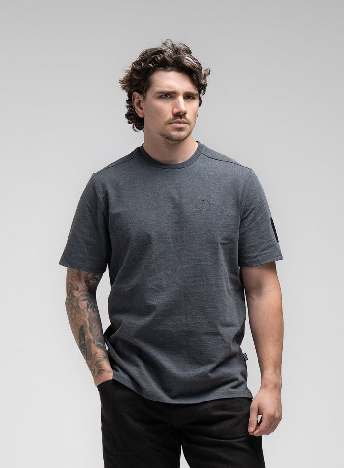 Jack Is 6ft 3" And Wears Size: L | Hem Studio Image Of Model Wearing Insignia T-Shirt - Black Mark In Charcoal Grey (SS Model)