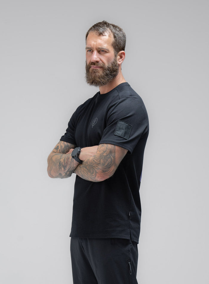 Louis Is 5ft 10" And Wears Size: M | Hem Studio Image Of Model Wearing Insignia T-Shirt - Made For Rock In Obsidian Black (SS Model)