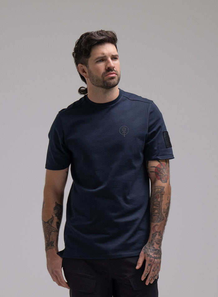 George Is 5ft 11" And Wears Size: S | Hem Studio Image Of Model Wearing Insignia T-Shirt G1 In Dark Sapphire (SS Model)