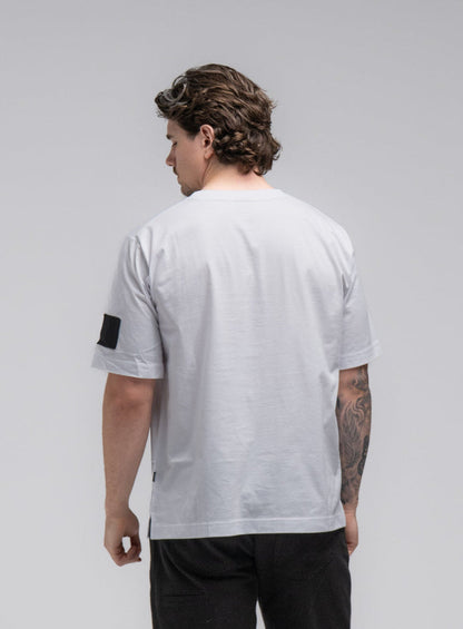 Jack Is 6ft 3" And Wears Size: L | Hem Studio Image Of Model Wearing Jackal T-Shirt In Optic White (SS Model)