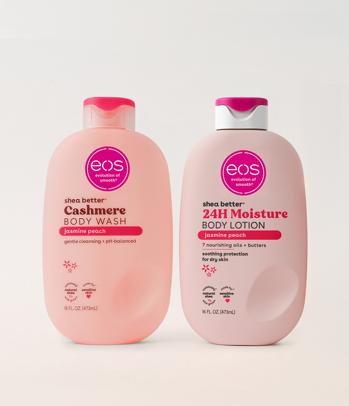 Two bottles of eos shea butter body wash and lotion on a white background