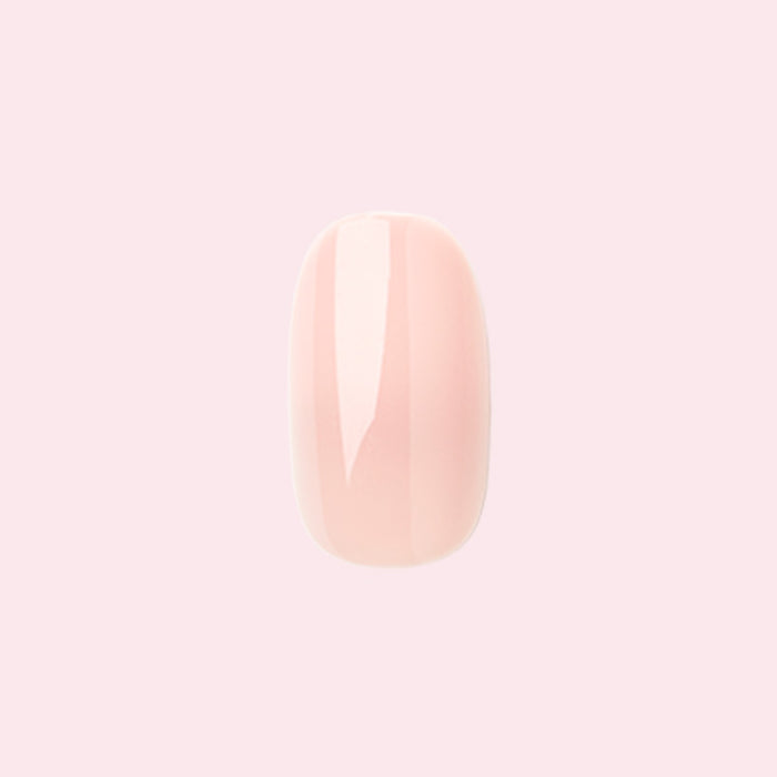 KAG - Press-On | Short | Round single neutral peachy pink false nail with glossy finish on light pink background