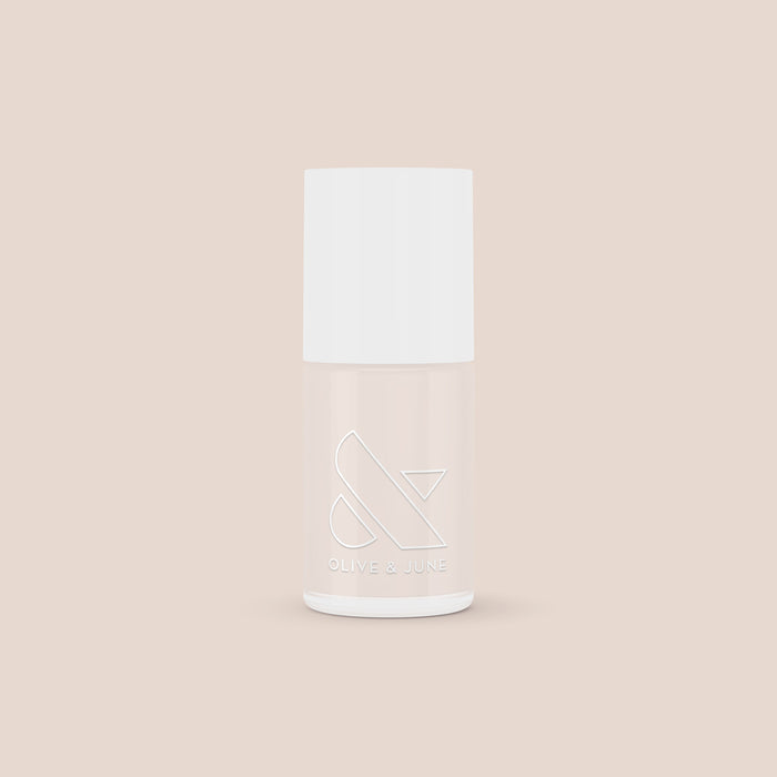 Olive and June LHG nail polish bottle in a fresh neutral shade with a subtle pink tint for classic manicures