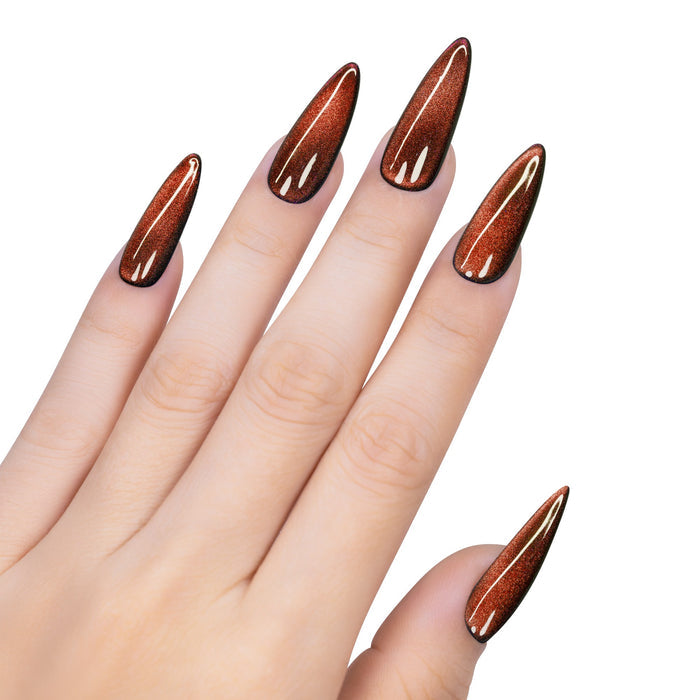 Hand with long, pointed nails painted with a brown nail polish on a white background