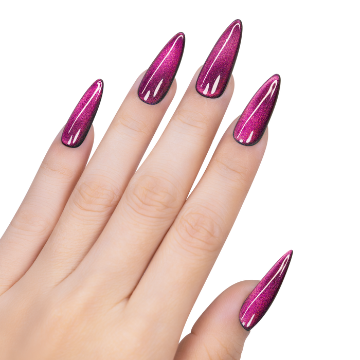 Hand with pink glittery nail polish on a white background