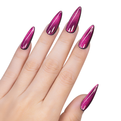 Hand with pink glittery nail polish on a white background