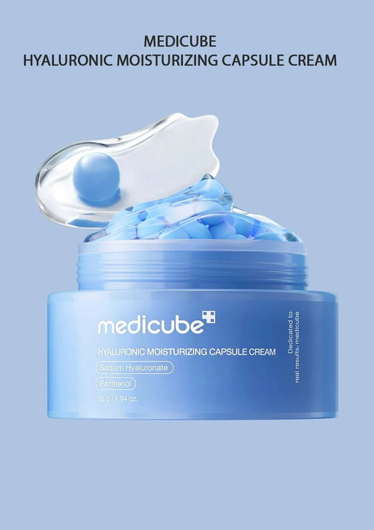 Medicube Hyaluronic Moisturizing Capsule Cream jar with blue cream on a light blue background