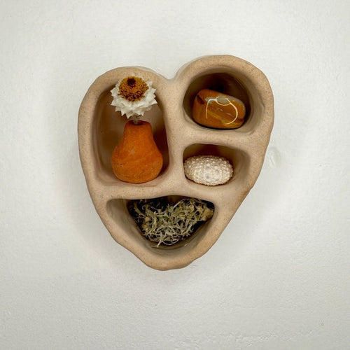 Sand-colored cement heart trinket holder with 4 inset compartments