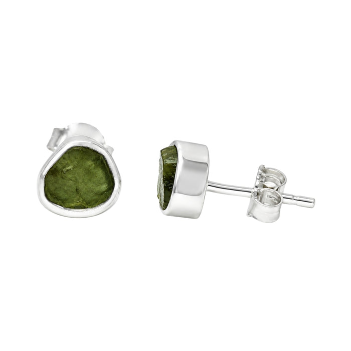 A pair of sterling silver stud earrings featuring rough Moldavite shown on a plain white background with one earring facing forward and the other showing the side profile and post backing.