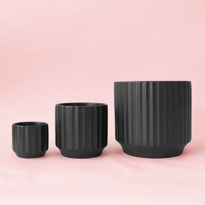 Black ribbed planters: small round pot, medium pot, and large bowl pot