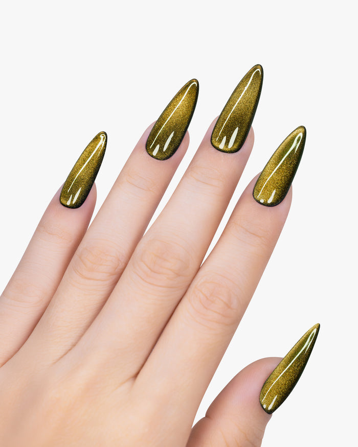 Hand with gold metallic nail polish on a white background