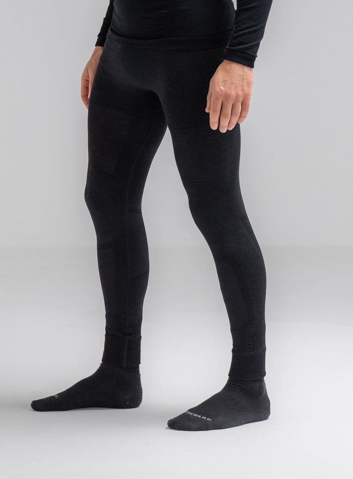 Louis Is 5ft 10" And Wears Size: M | Hem Studio Image Of Model Wearing Mountain Pro Merino Cordura® Base Layer Bottoms In Obsidian Black (SS Model)