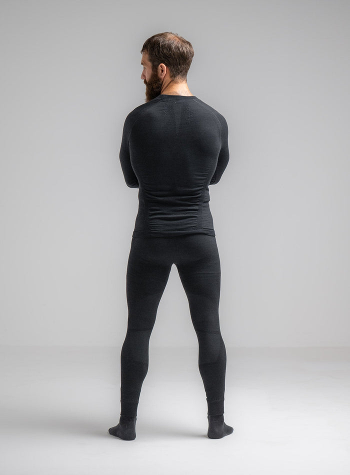 Louis Is 5ft 10" And Wears Size: M | Hem Studio Image Of Model Wearing Mountain Pro Merino Cordura® Base Layer Bottoms In Obsidian Black (SS Model)