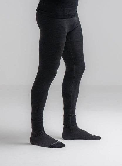 Louis Is 5ft 10" And Wears Size: M | Hem Studio Image Of Model Wearing Mountain Pro Merino Cordura® Base Layer Bottoms In Obsidian Black (SS Model)