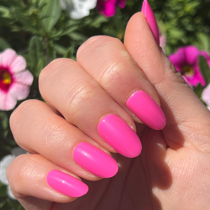 Neon Flamingo | Oval | Medium vibrant hot pink press-on nails in medium oval shape for a bright at-home manicure