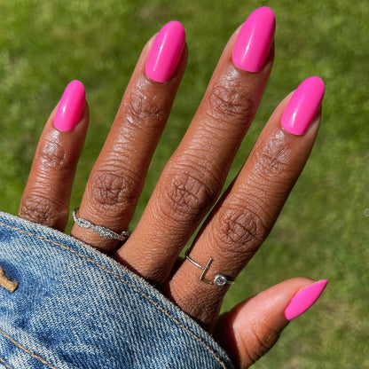 Neon Flamingo | Oval | Medium press-on nails in bright electric pink with a smooth finish for an easy at-home manicure