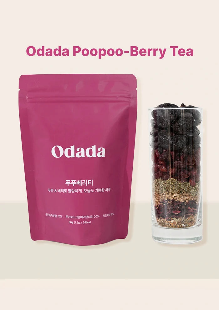 Odada Poopoo-Berry Tea package and glass with tea leaves on a light pink background
