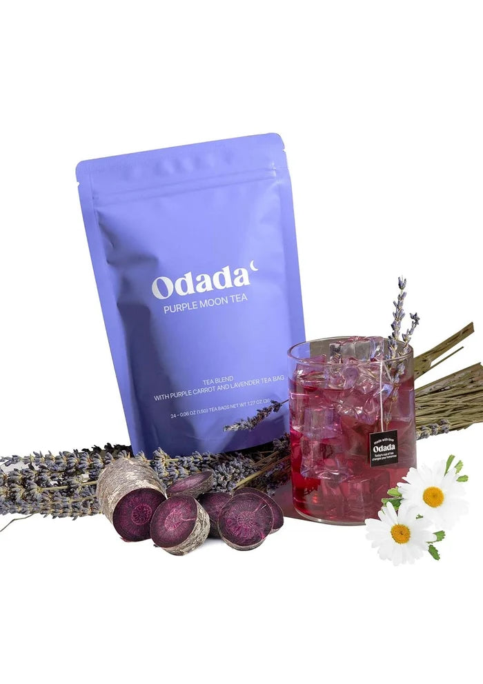 Odada Purple Moon Tea package with a glass of tea, lavender, and flowers on a white background