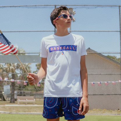 Youth model wearing red Paisley Freedom youth graphic tee
