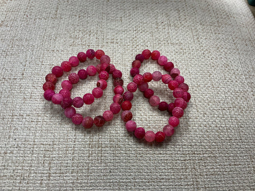 Pink glass beaded bracelet with round beads, stylish jewelry accessory from American Unique Group.