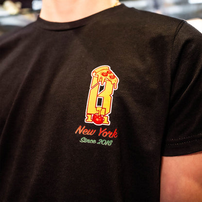 Youth model wearing black youth graphic tee with “Pizza Guy” design