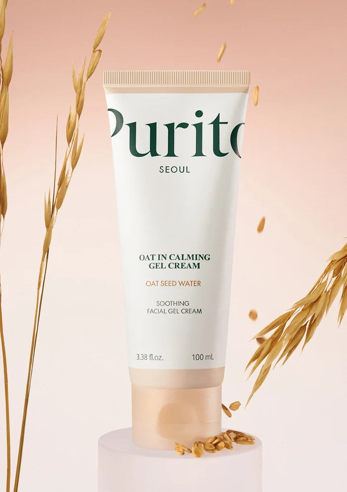 Purito oat cream tube with oats on a pink background