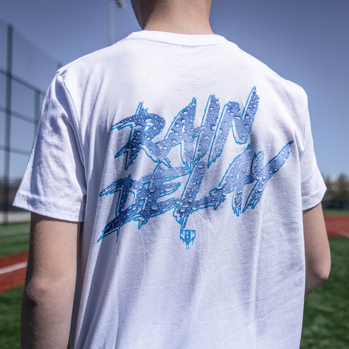 Youth model wearing white Rain Delay youth graphic tee
