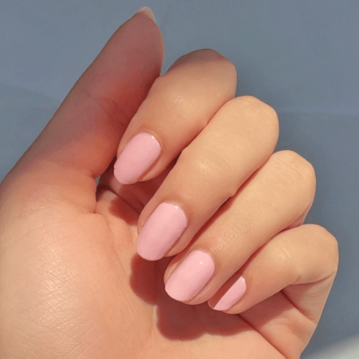 Hand showing nails polished with Rosy Tips gel polish in soft rose pink for a fresh manicure look
