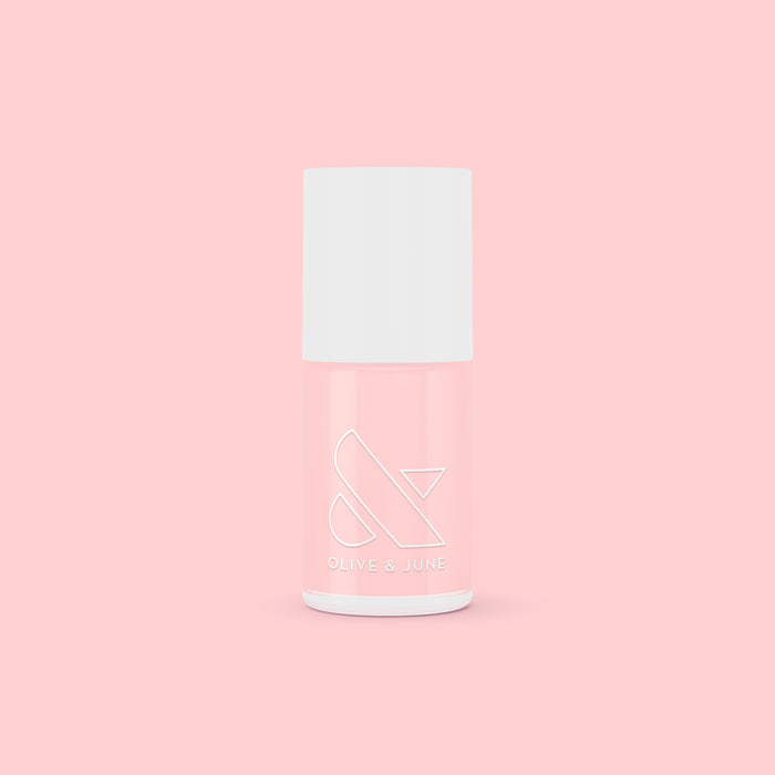 SCL nail polish bottle in soft bubblegum pink shade against a matching light pink background