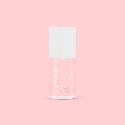 SCL nail polish bottle in soft bubblegum pink shade against a matching light pink background