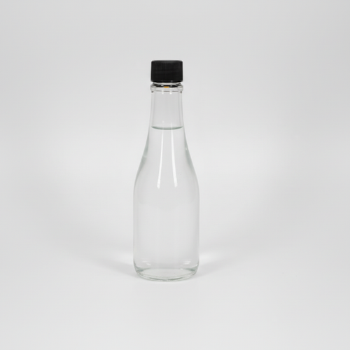 Clear glass bottle with a black cap on a white background