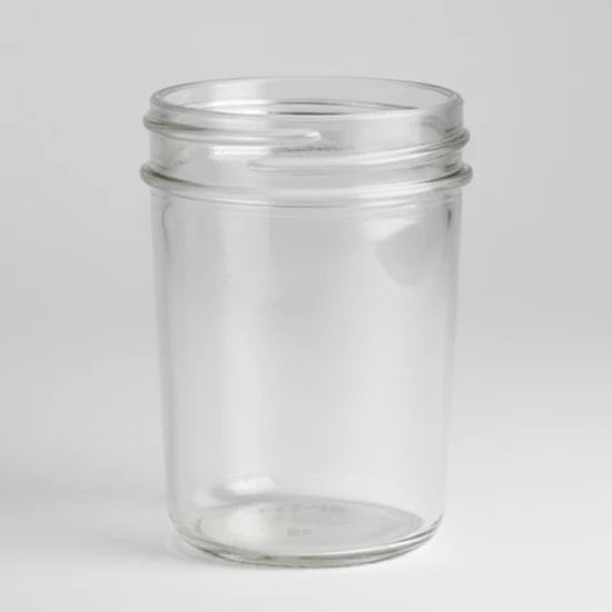 Clear glass jar on a white background