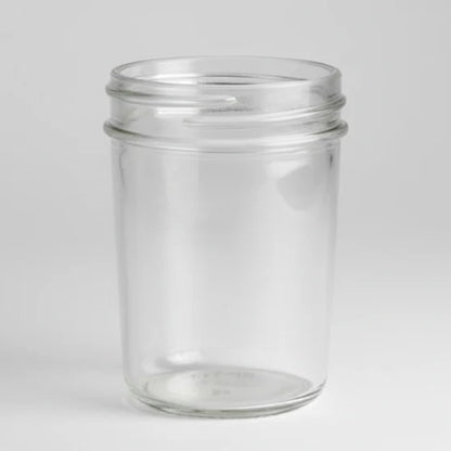 Clear glass jar on a white background