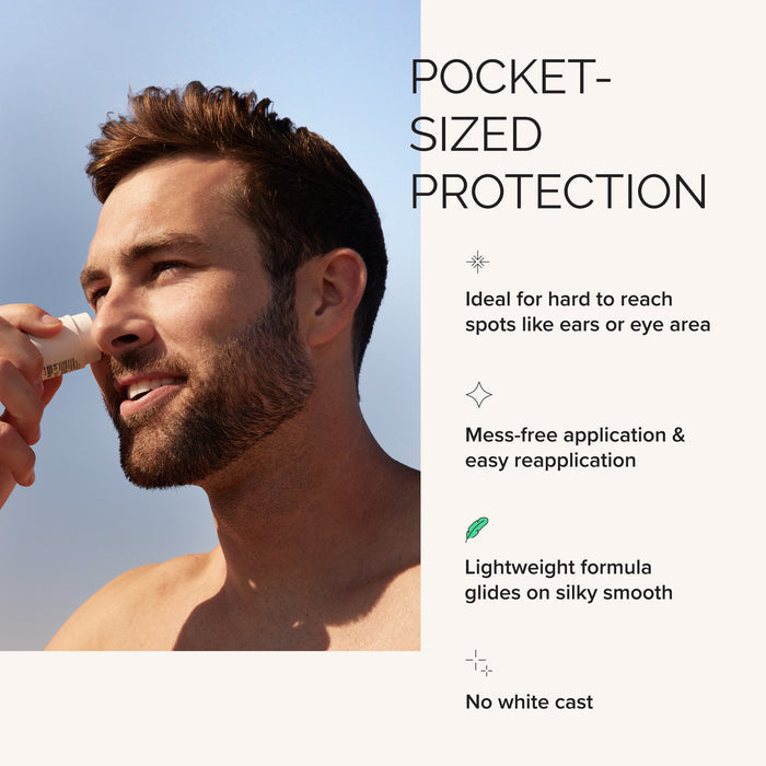 Man applying sunscreen to his face