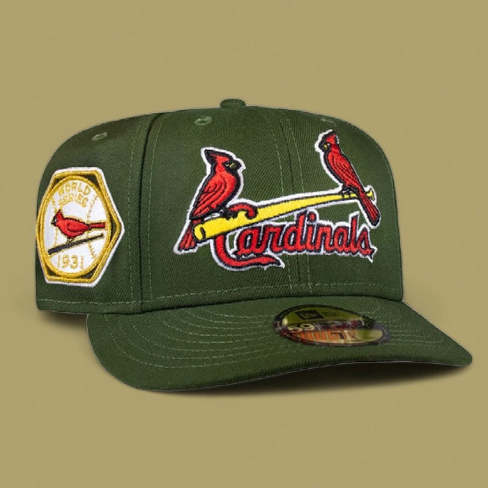 A green St. Louis Cardinals baseball cap with the team's logo and a patch commemorating the 1931 World Series on a yellow background.