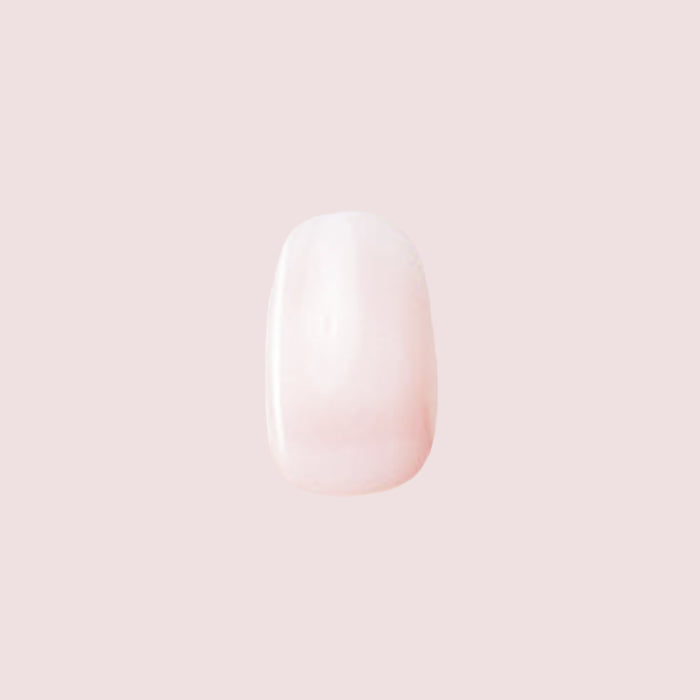 Single nail featuring Strawberry Scone - Press-On | XS | Round with extra-short, semi-sheer pink press-on manicure design