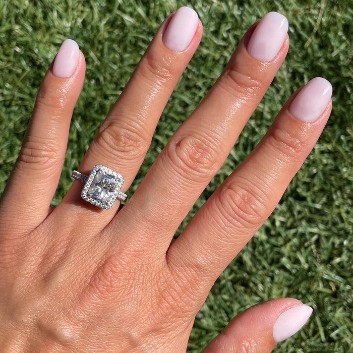 Hand displaying Strawberry Scone - Press-On | XS | Round with extra-short, semi-sheer pink false nails manicure style