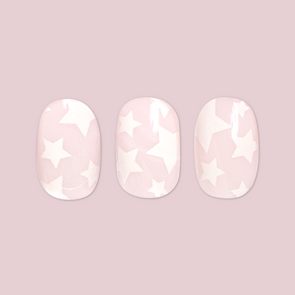 Super Stars - Press-On | Short | Round three short round false nails with white star pattern on pale pink background