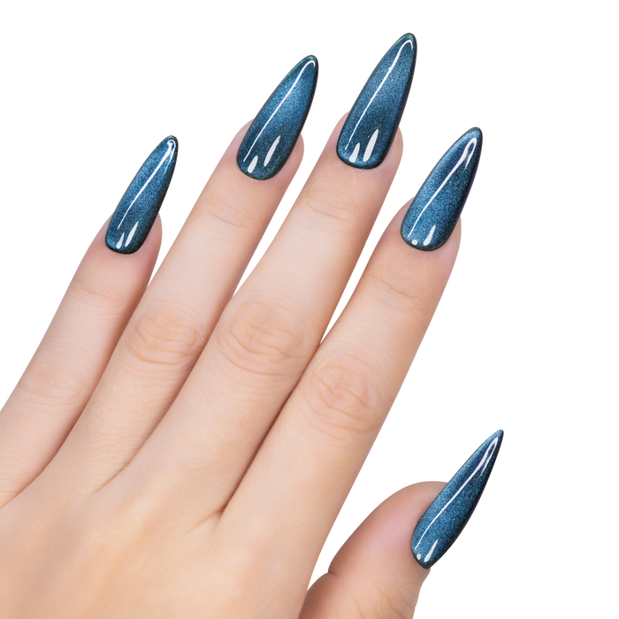 Hand with blue glittery nail polish on a white background