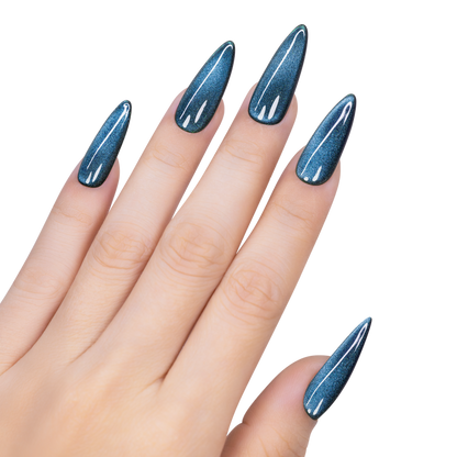 Hand with blue glittery nail polish on a white background
