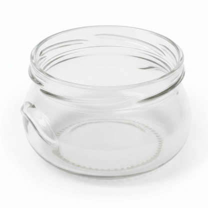 Clear glass jar with a lid on a white background
