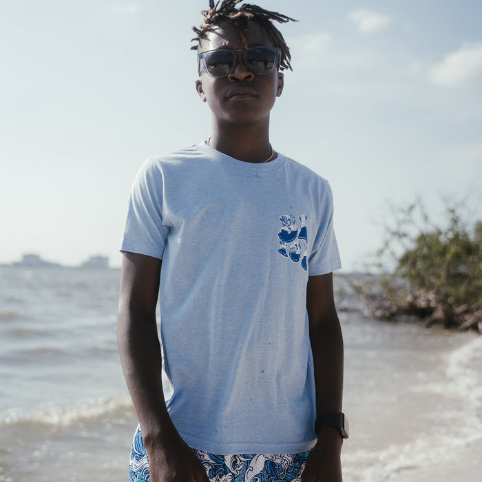 Youth model wearing blue Wave Cotton Candy Blue youth graphic tee