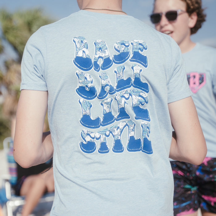 Youth model wearing blue Wave Cotton Candy Blue youth graphic tee