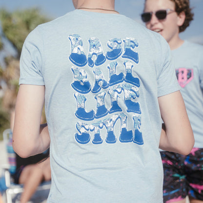 Youth model wearing blue Wave Cotton Candy Blue youth graphic tee