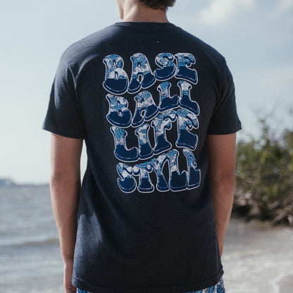 Youth model wearing navy Wave youth graphic tee